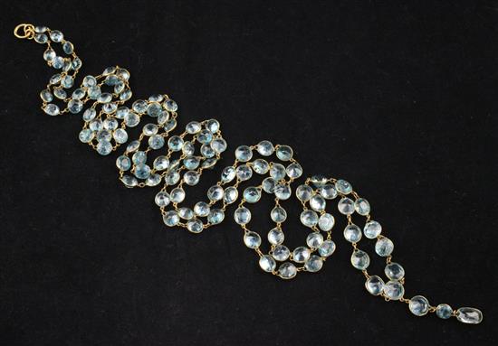 A gold and graduated blue zircon drop spectacle necklace, 46.5in.